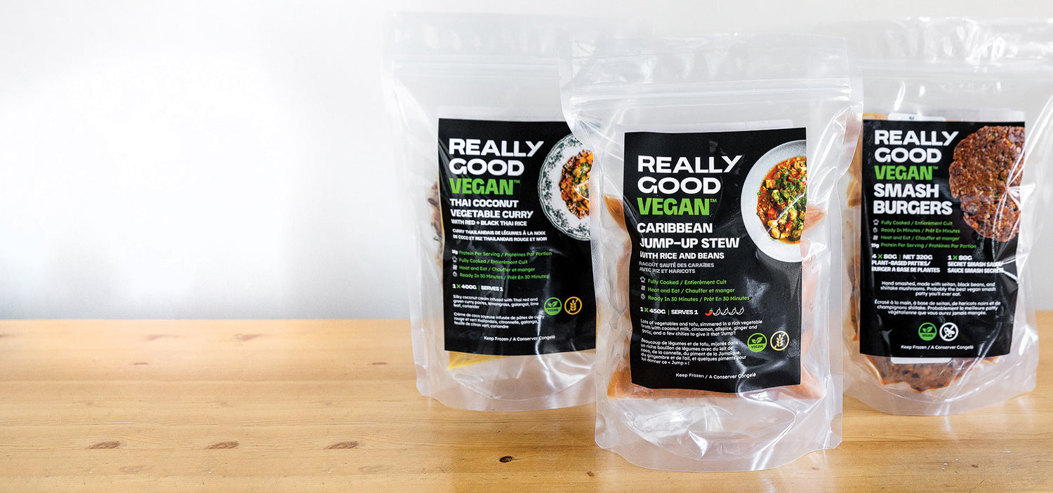Really Good Vegan Food Packaging Photo of Thai Coconut Vegetable Curry, Caribbean Jump-Up Stew, and Vegan Smash Burgers all Sous-vide